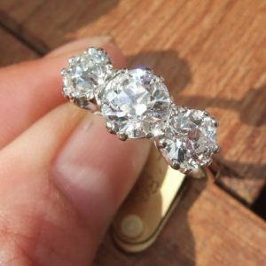 Old cut diamond trilogy ring almost 3 carats