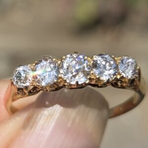 An old cut diamond 5 stone, full of fire!