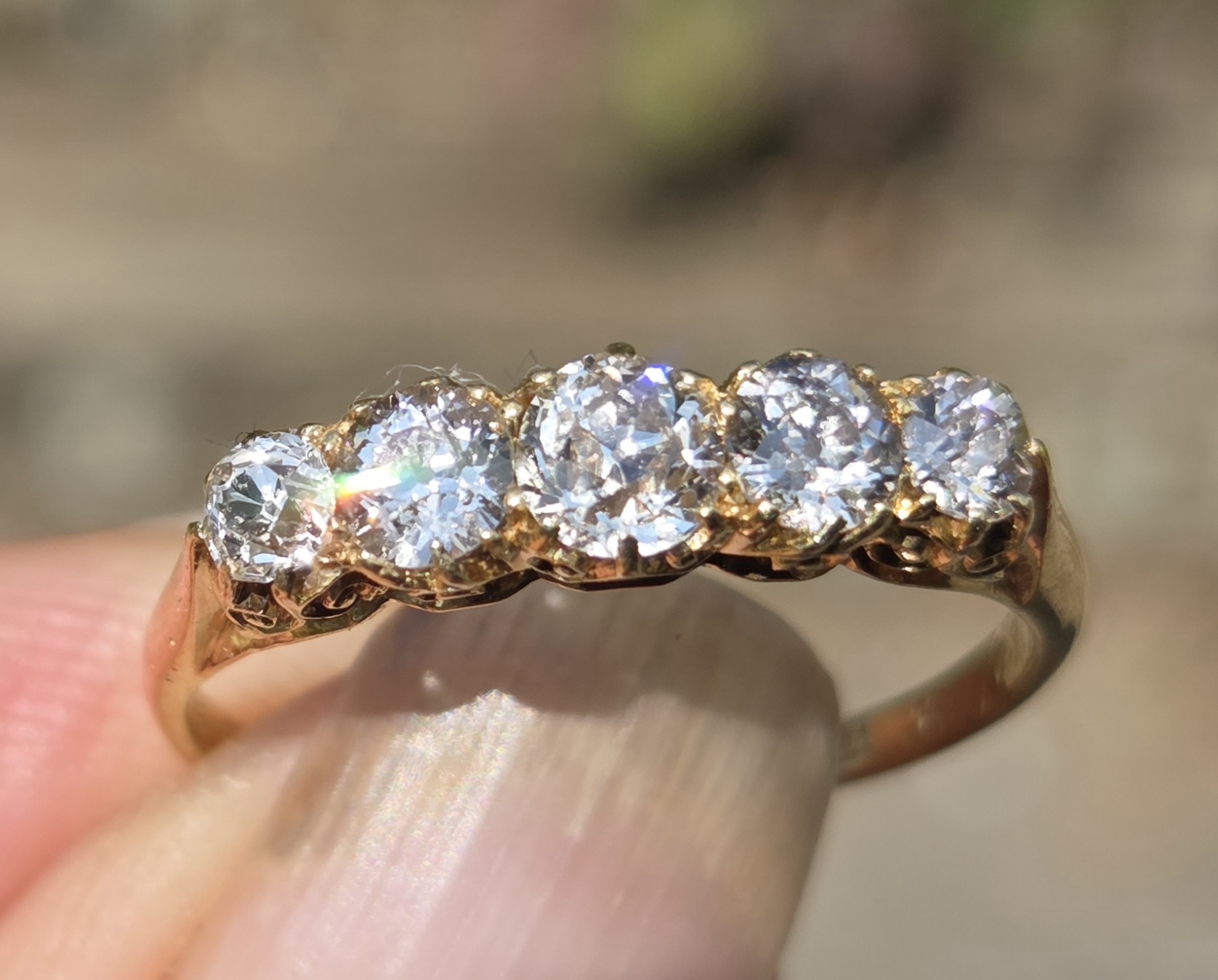 An old cut diamond 5 stone, full of fire!