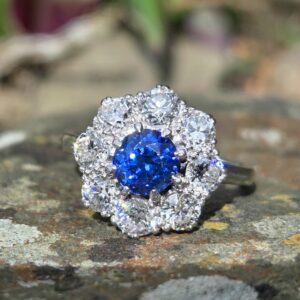 An Incredible natural Sapphire & old cut diamond cluster ring.